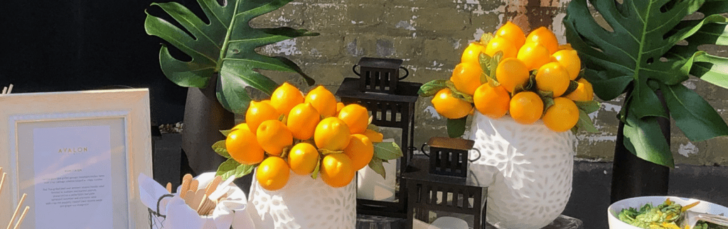 Flowers and oranges on table